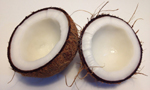 Open coconut on a white surface.