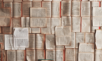 Photograph of open book pages spread out on a surface.